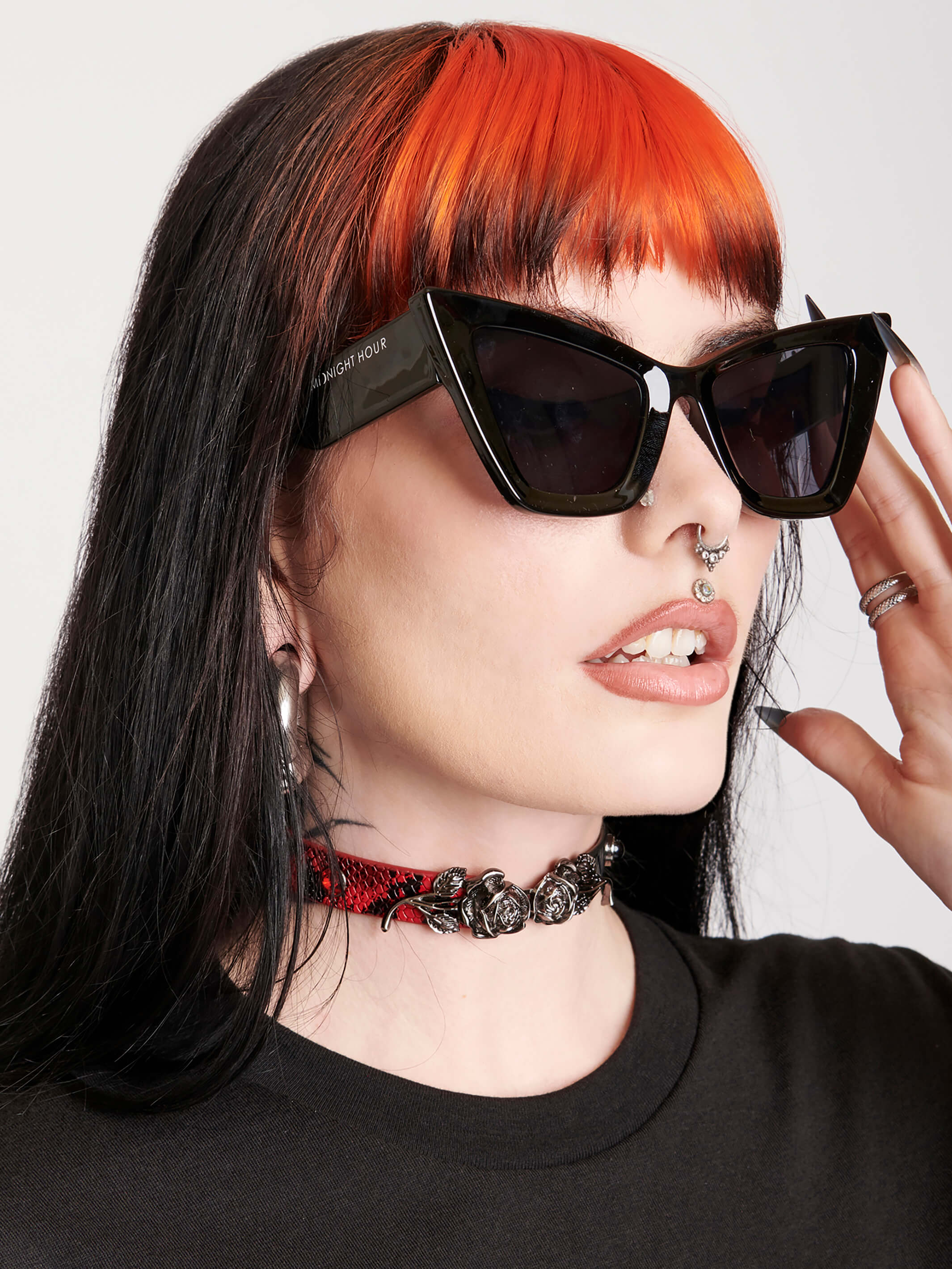 Black cat eye sunglasses with midnight hour logo