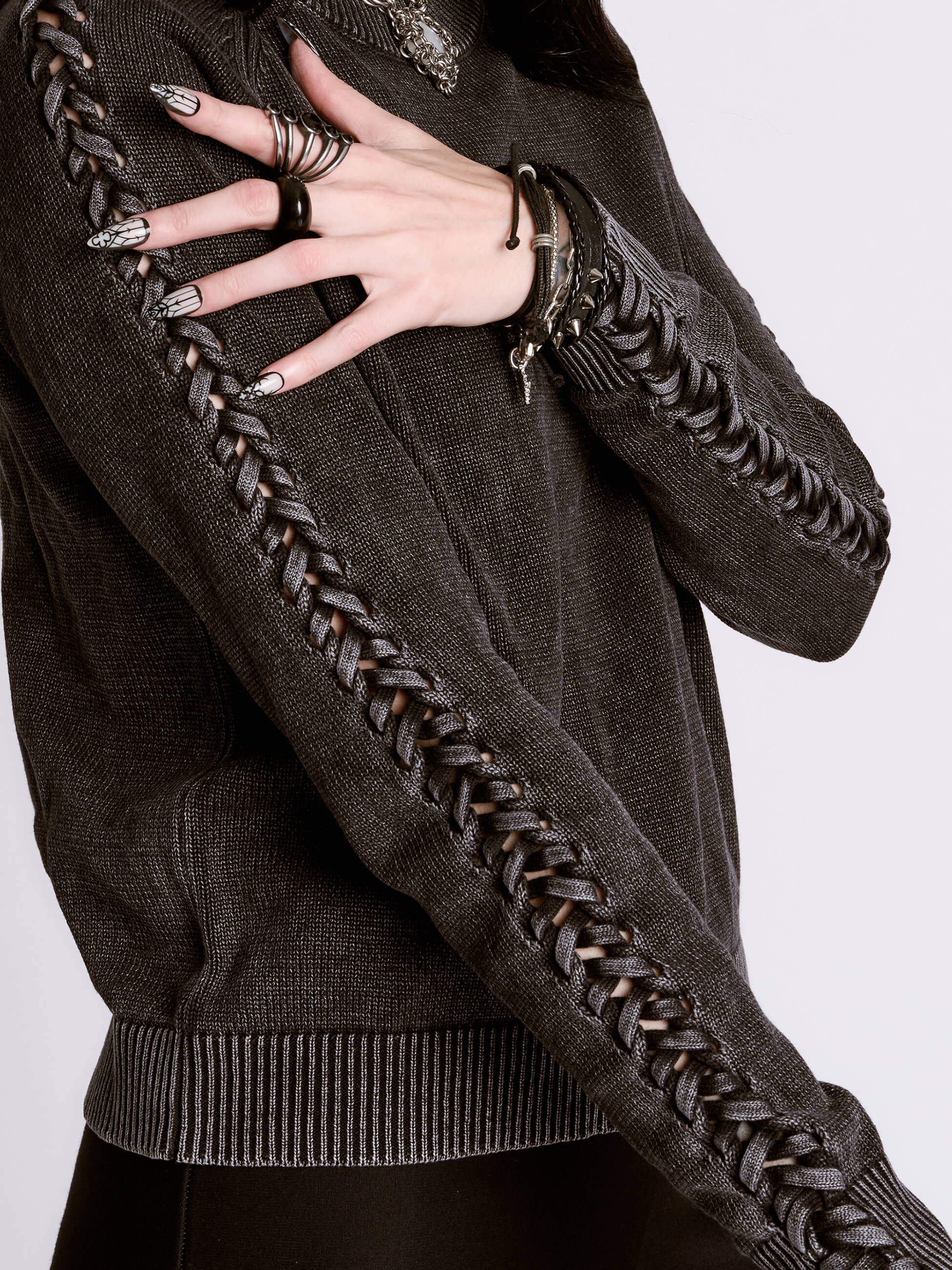distressed braided sweater