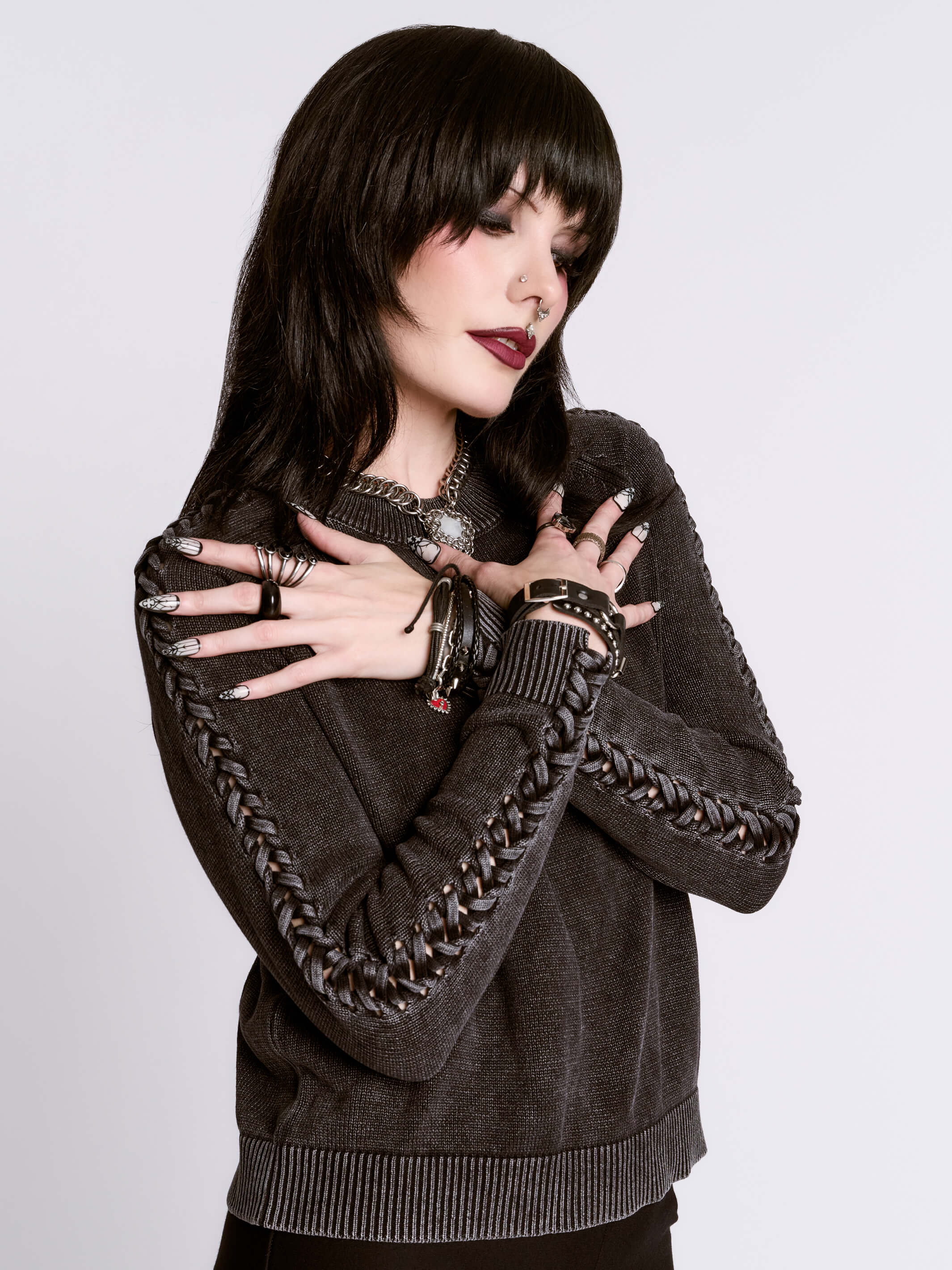 distressed braided sweater