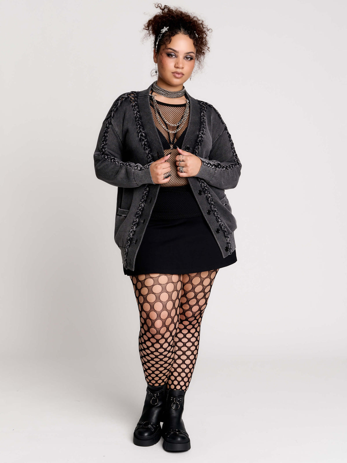 a dark gray textured cardigan with braided details