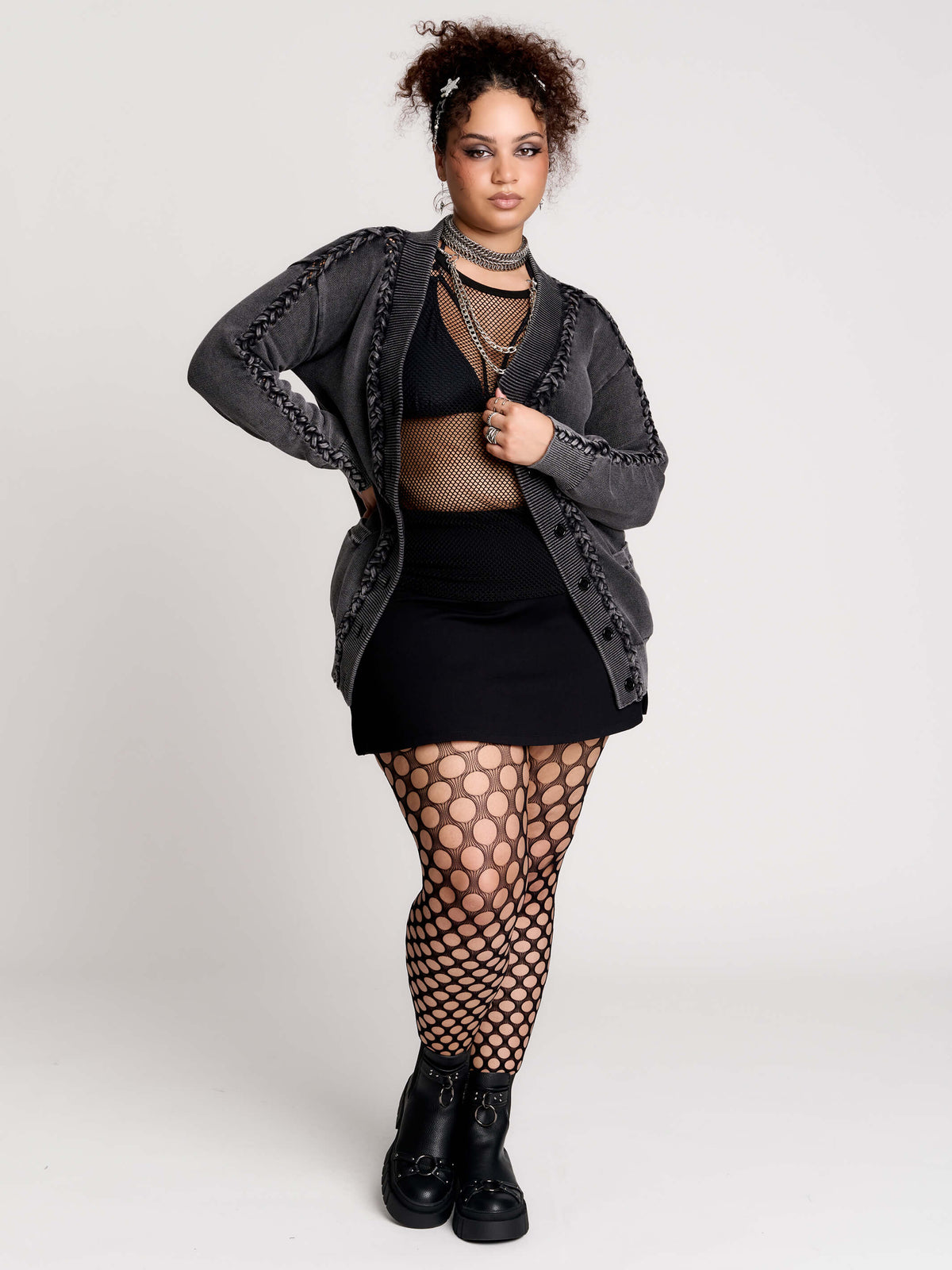 a dark gray textured cardigan with braided details