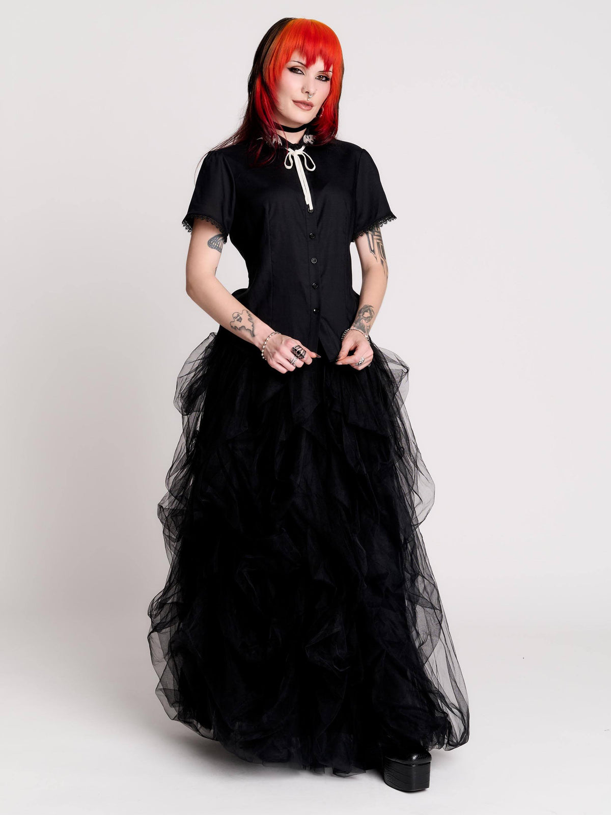 black short-sleeve blouse with white embroidered bat on collar and black lace trim