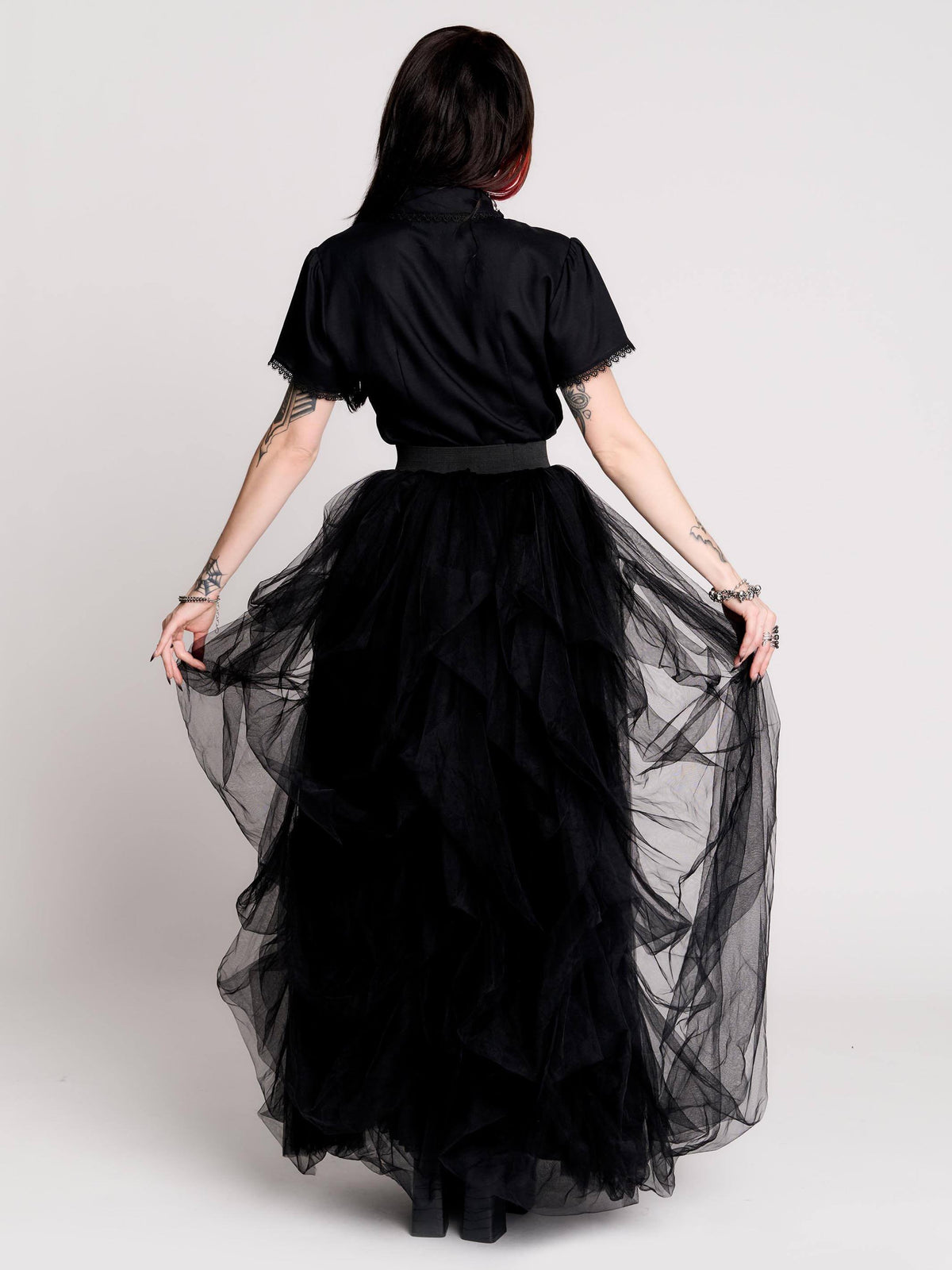 black short-sleeve blouse with white embroidered bat on collar and black lace trim