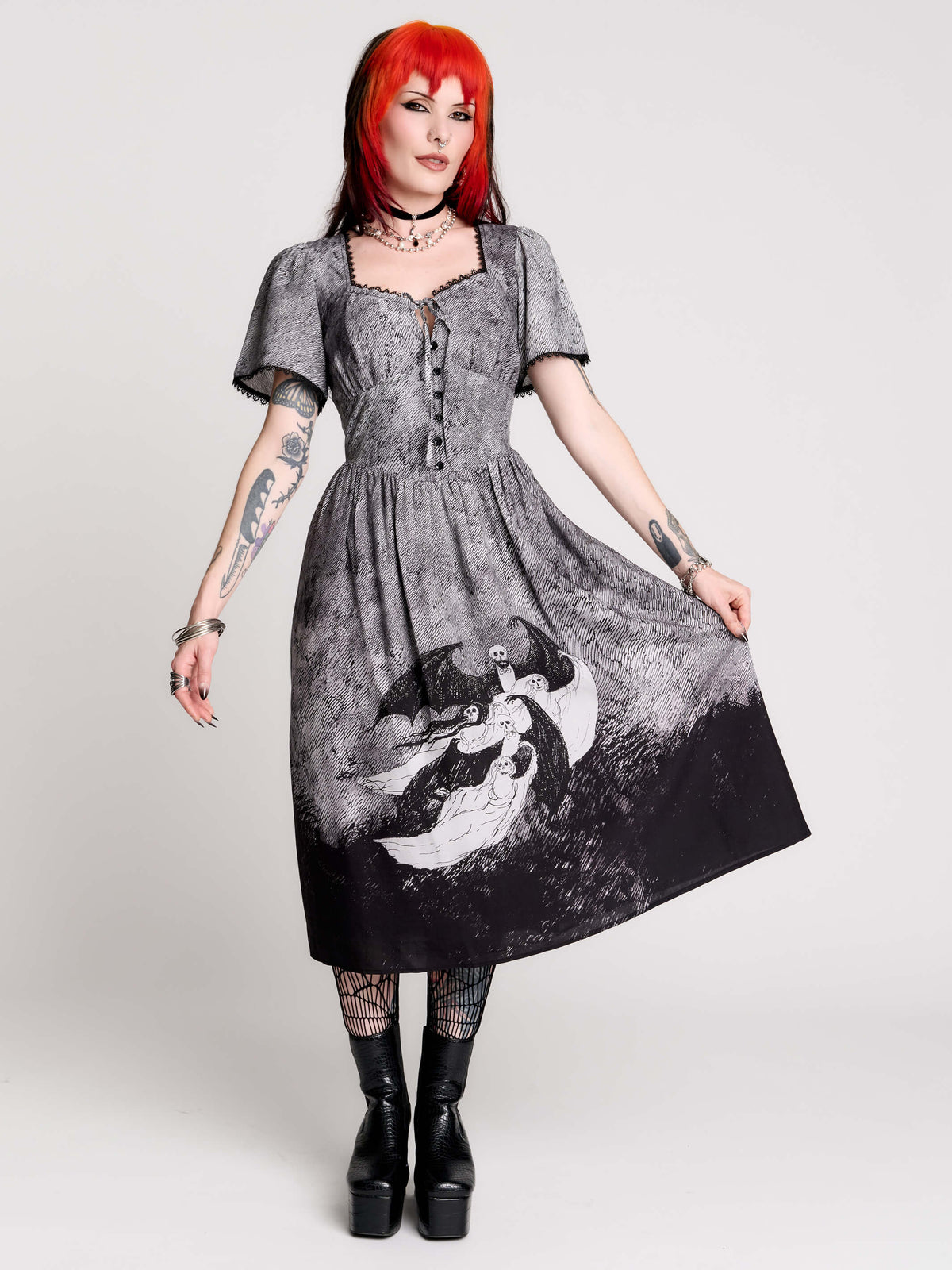 a short-sleeved gray and black gothic-style dress with a printed illustration of a winged figure