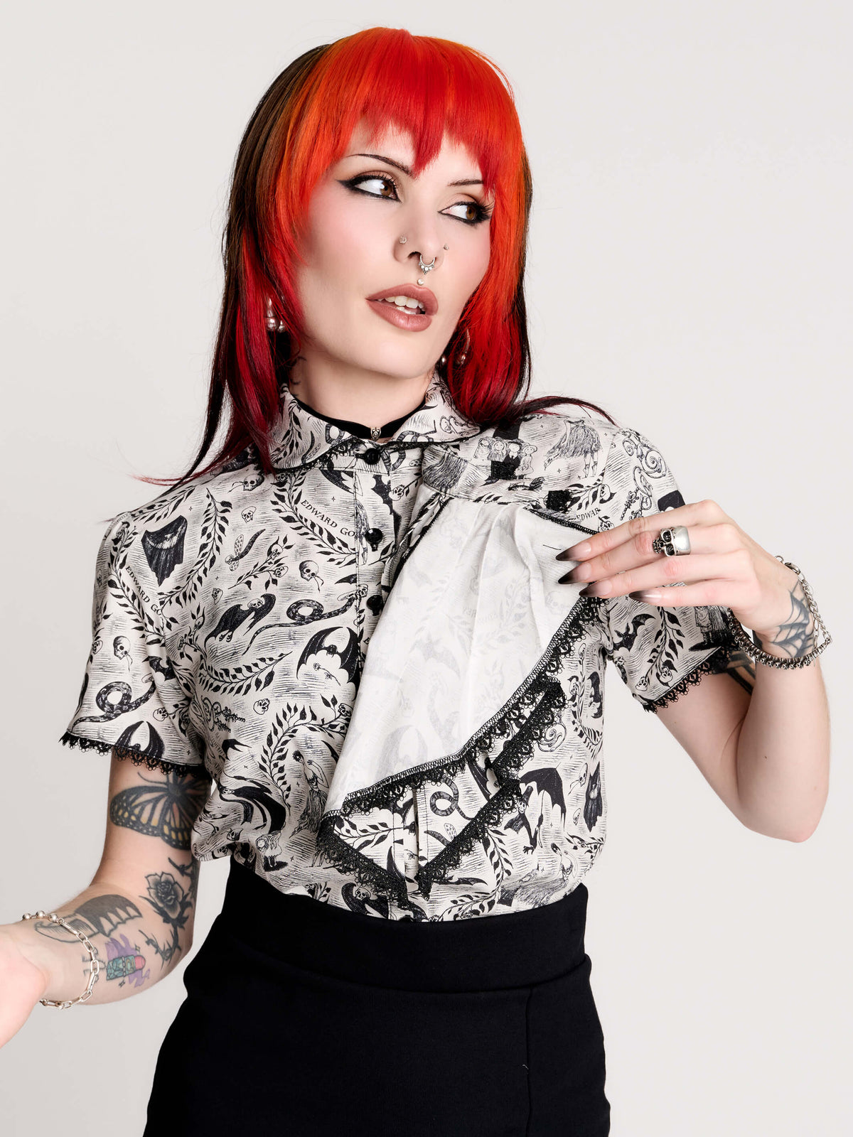 a black and white patterned ruffled blouse