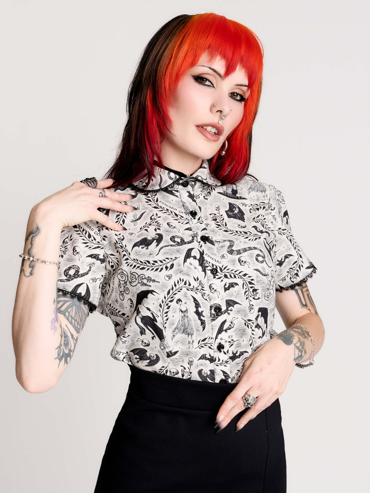 a black and white patterned ruffled blouse