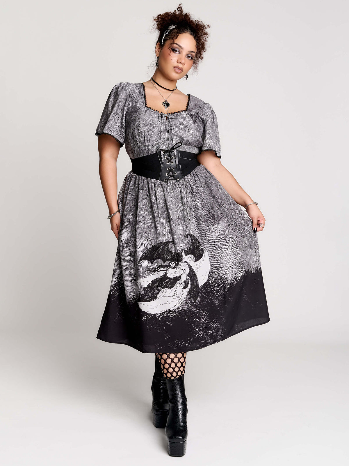short-sleeved gray and black gothic-style midi dress with a printed illustration of a woman and winged figure at the hem