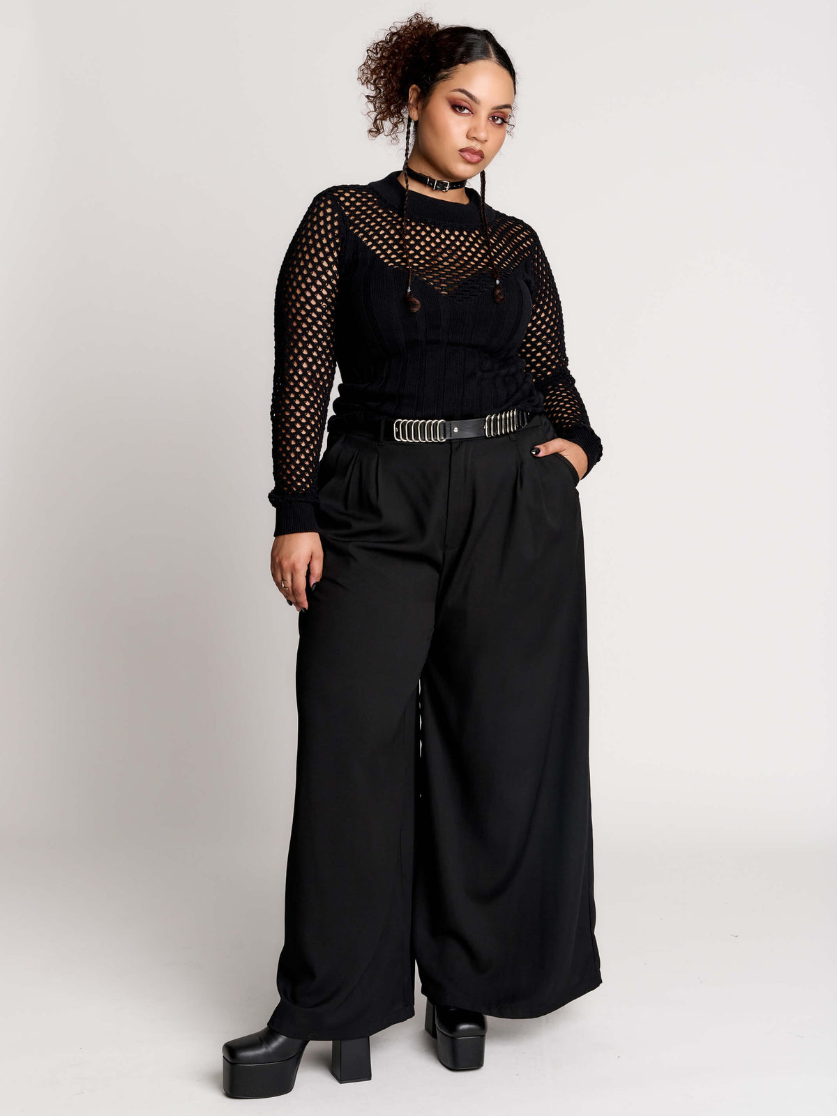 Fishnet Sweetheart Rib Sweater, a black long-sleeve top with a fitted rib-knit body and fishnet across the upper chest, shoulders, upper back and sleeves, giving a “sweetheart” illusion while keeping the sleek silhouette sleek.