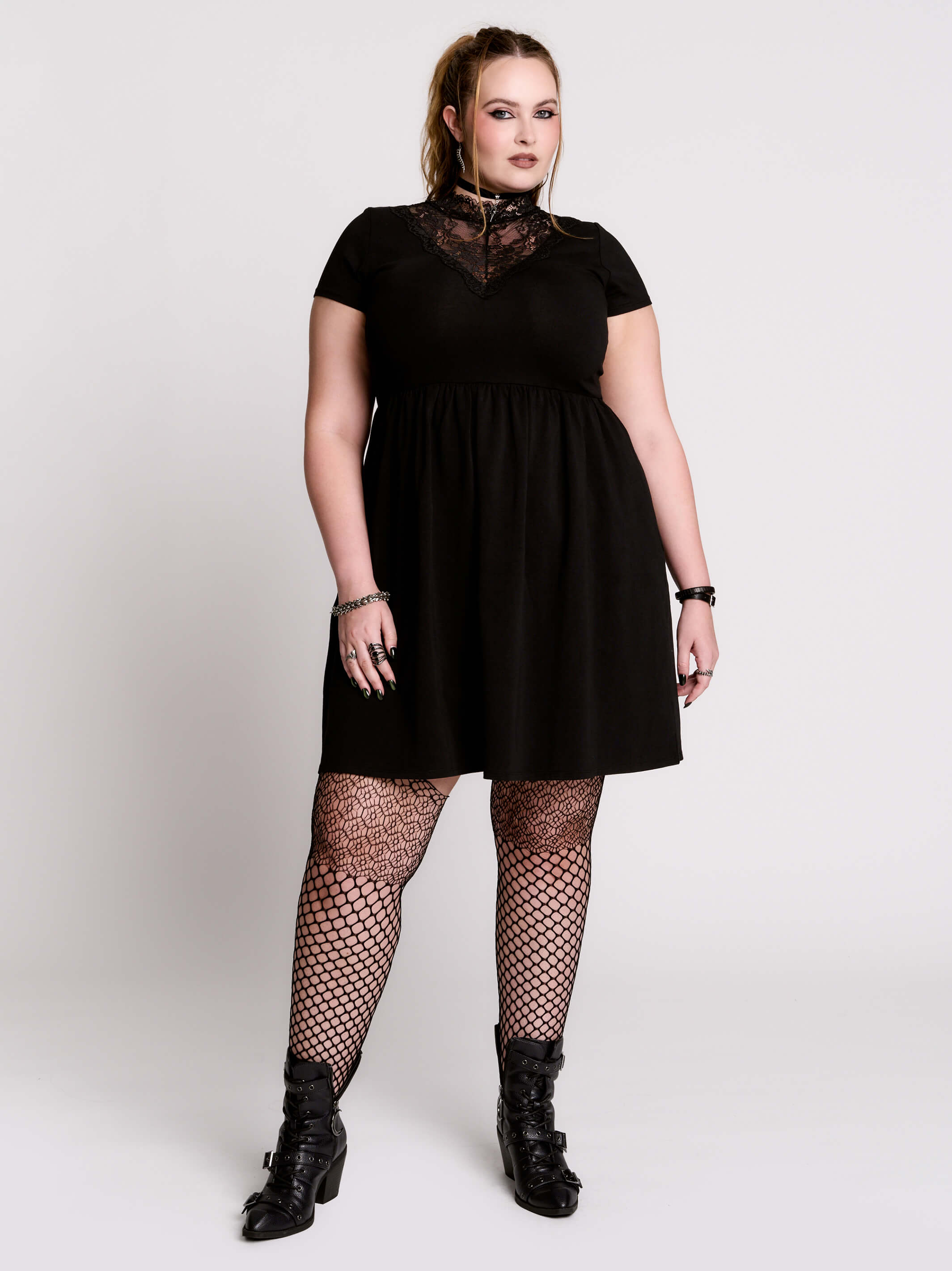 A black short-sleeve dress with a lace V-neckline.