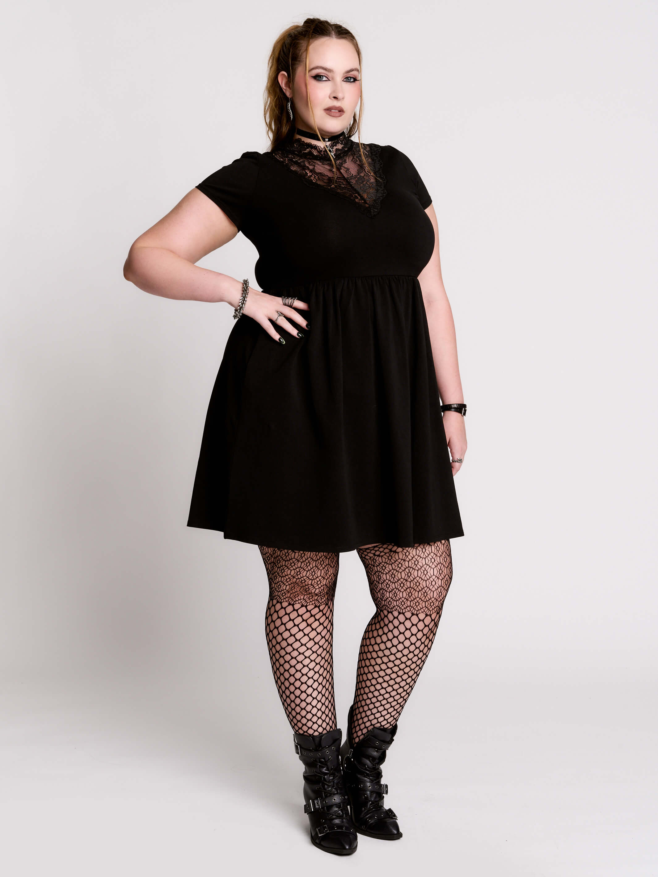 A black short-sleeve dress with a lace V-neckline.