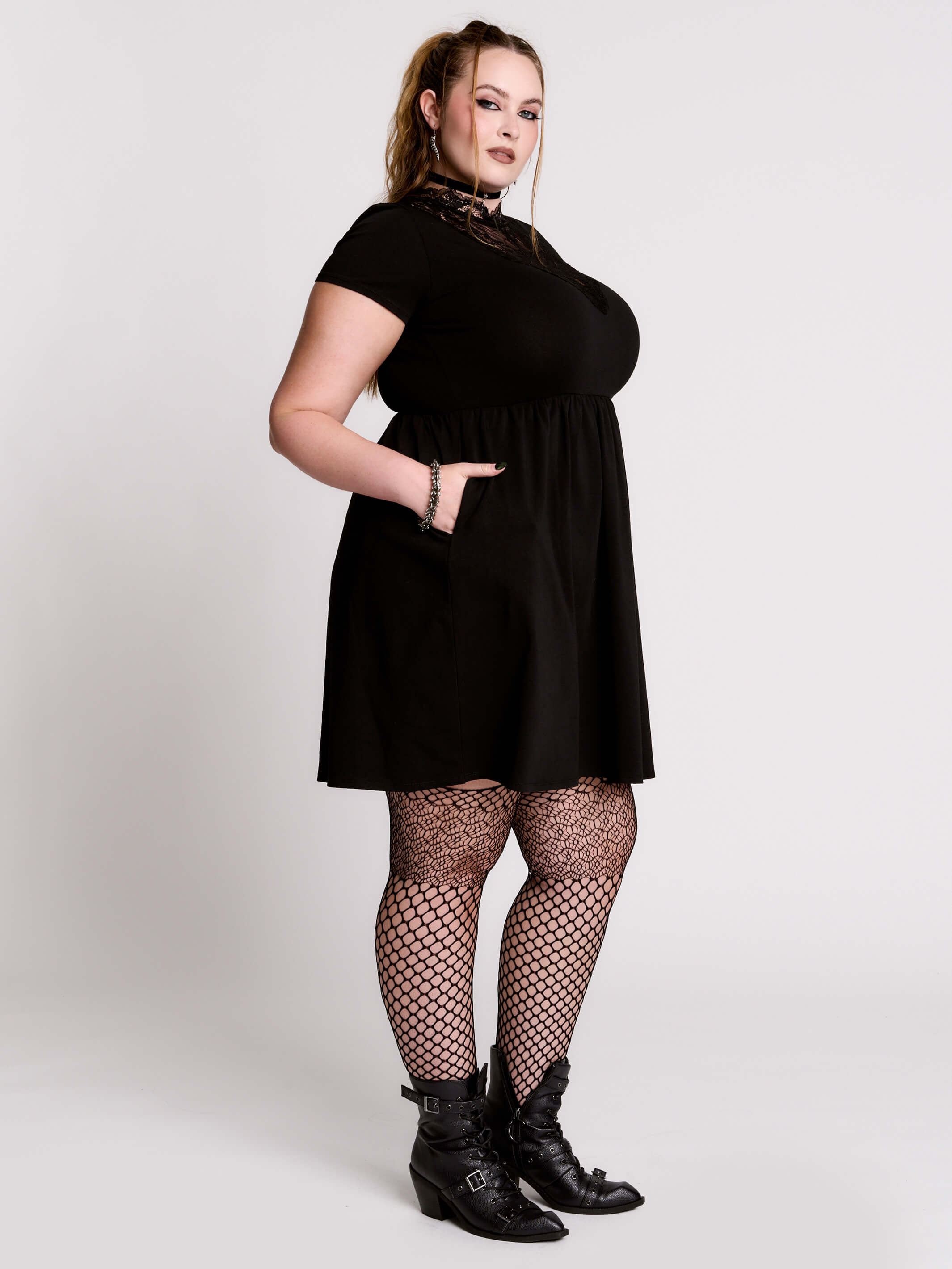 A black short-sleeve dress with a lace V-neckline.