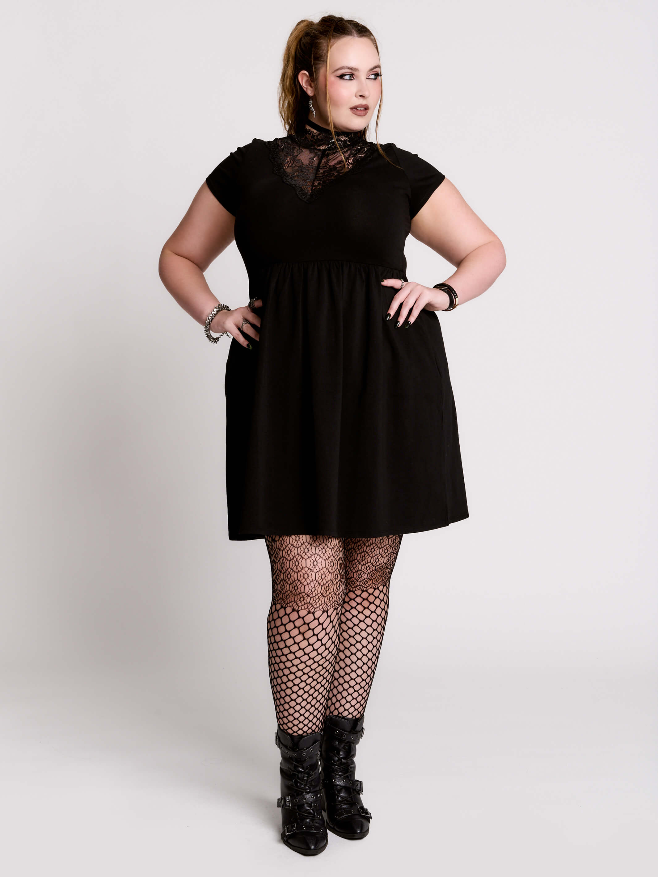 A black short-sleeve dress with a lace V-neckline.