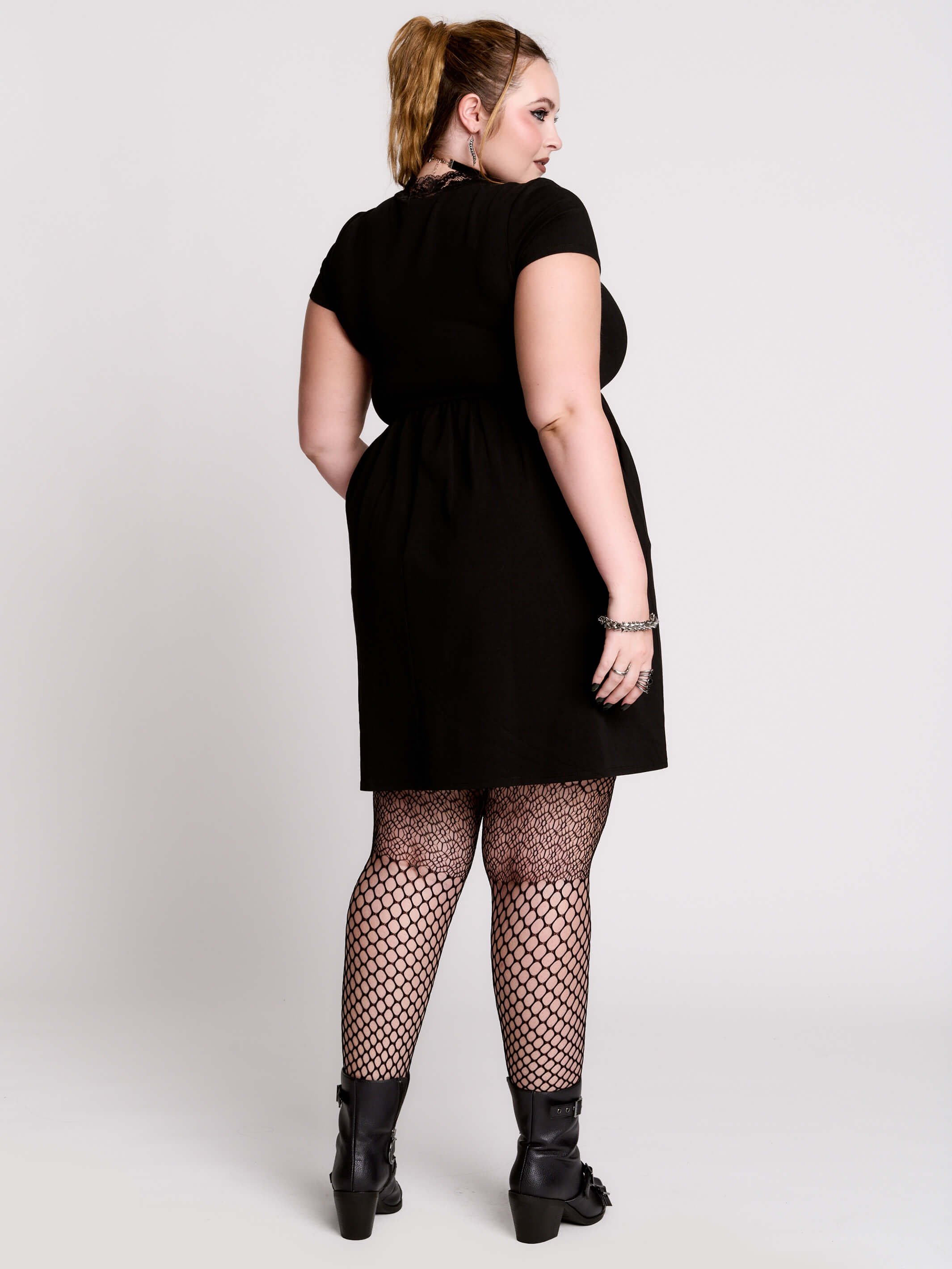 A black short-sleeve dress with a lace V-neckline.