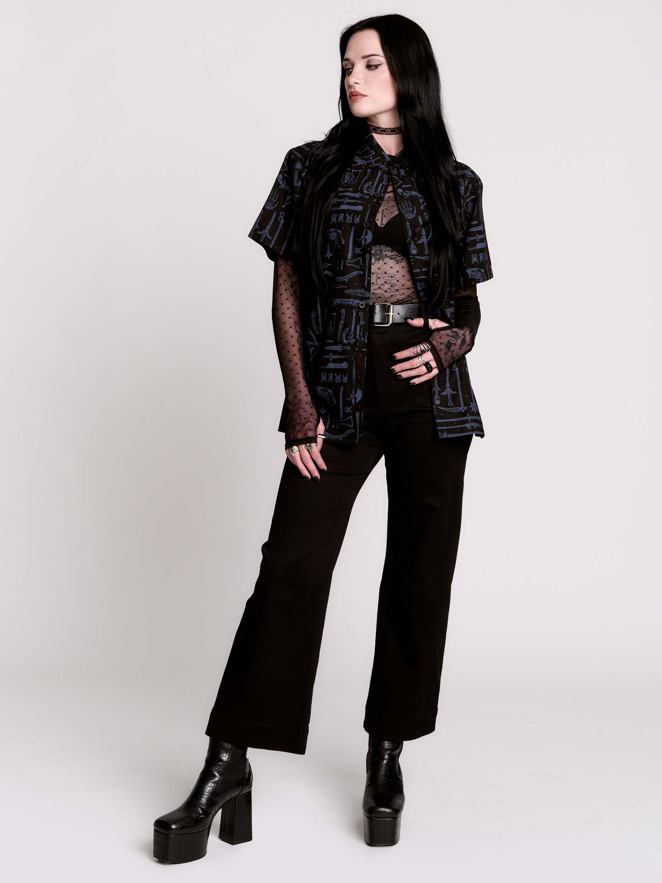 short-sleeve button-down that mixes crisp classic shirting with dark, gothic illustration.