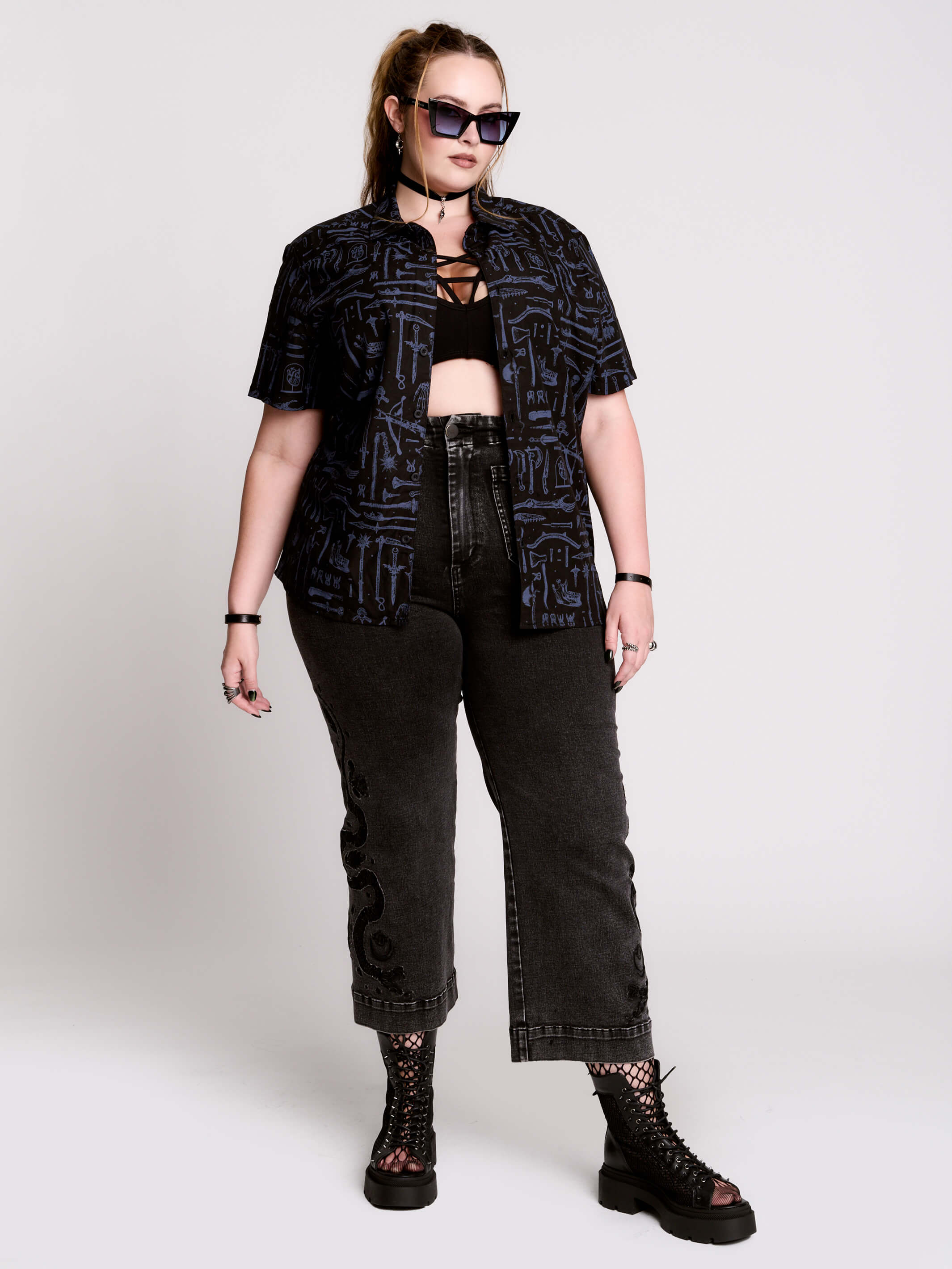 short-sleeve button-down that mixes crisp classic shirting with dark, gothic illustration.