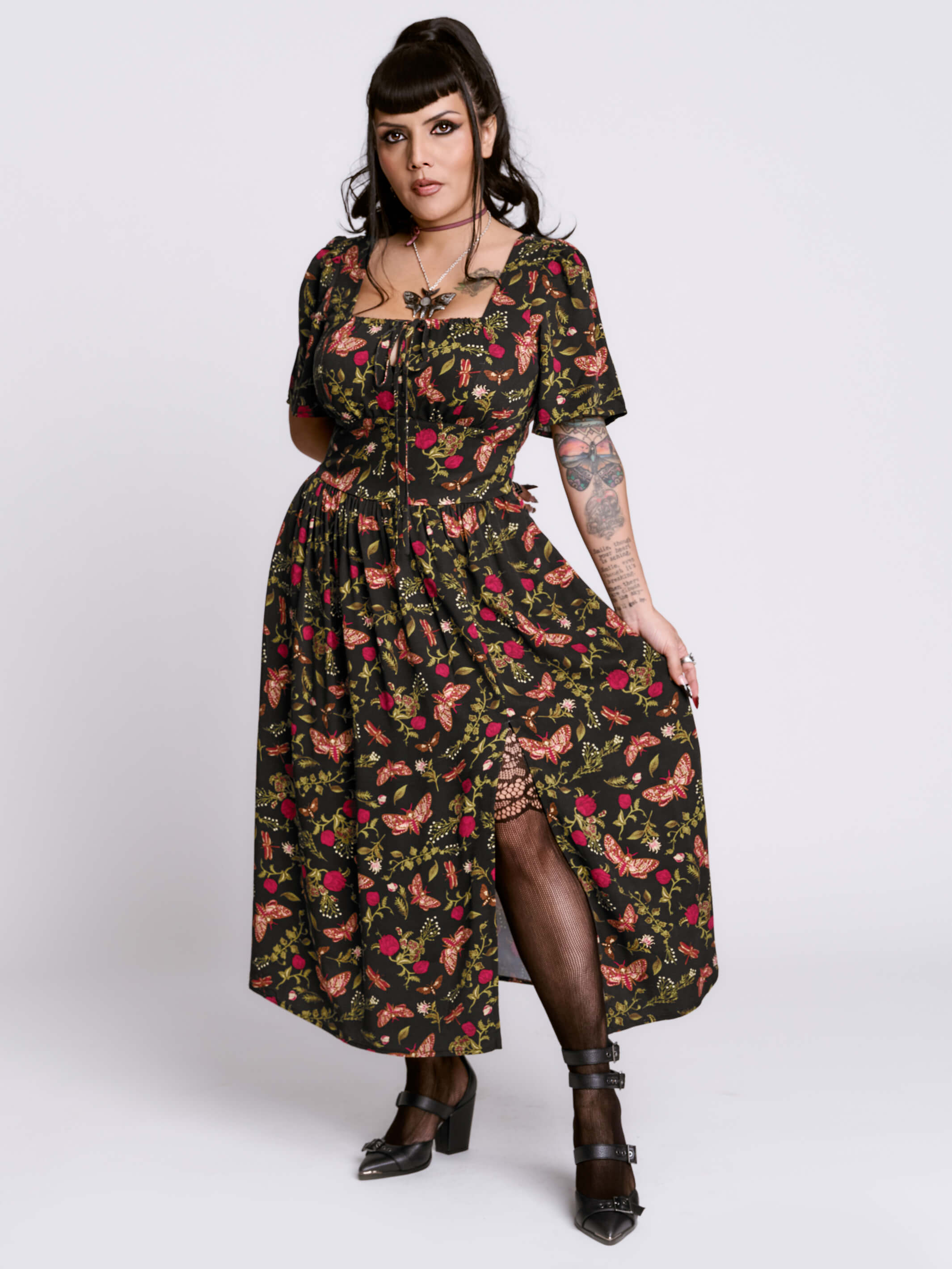 Woman wearing a floral dress with a white background