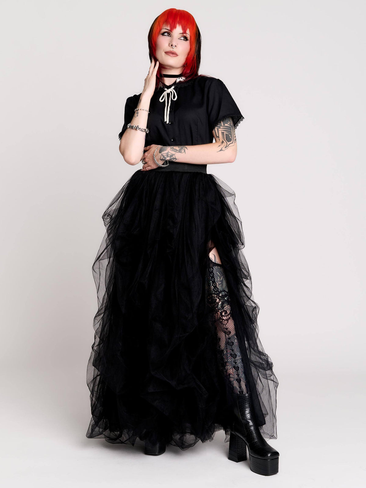 a voluminous layered black tulle skirt.