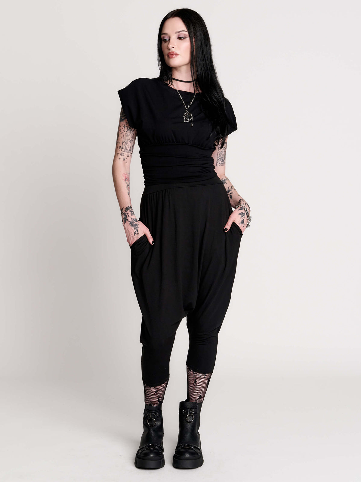 short sleeve top with a softly draped silhouette and a flattering, cinched waist.