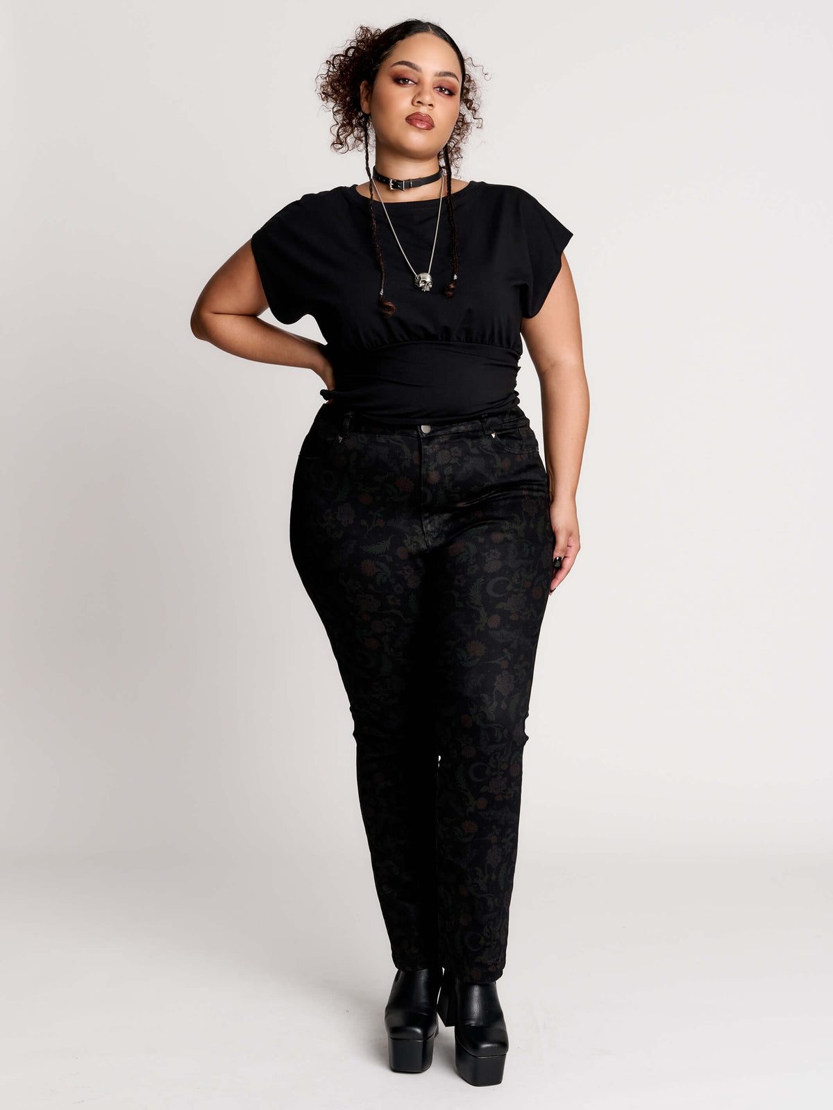 short sleeve top with a softly draped silhouette and a flattering, cinched waist.