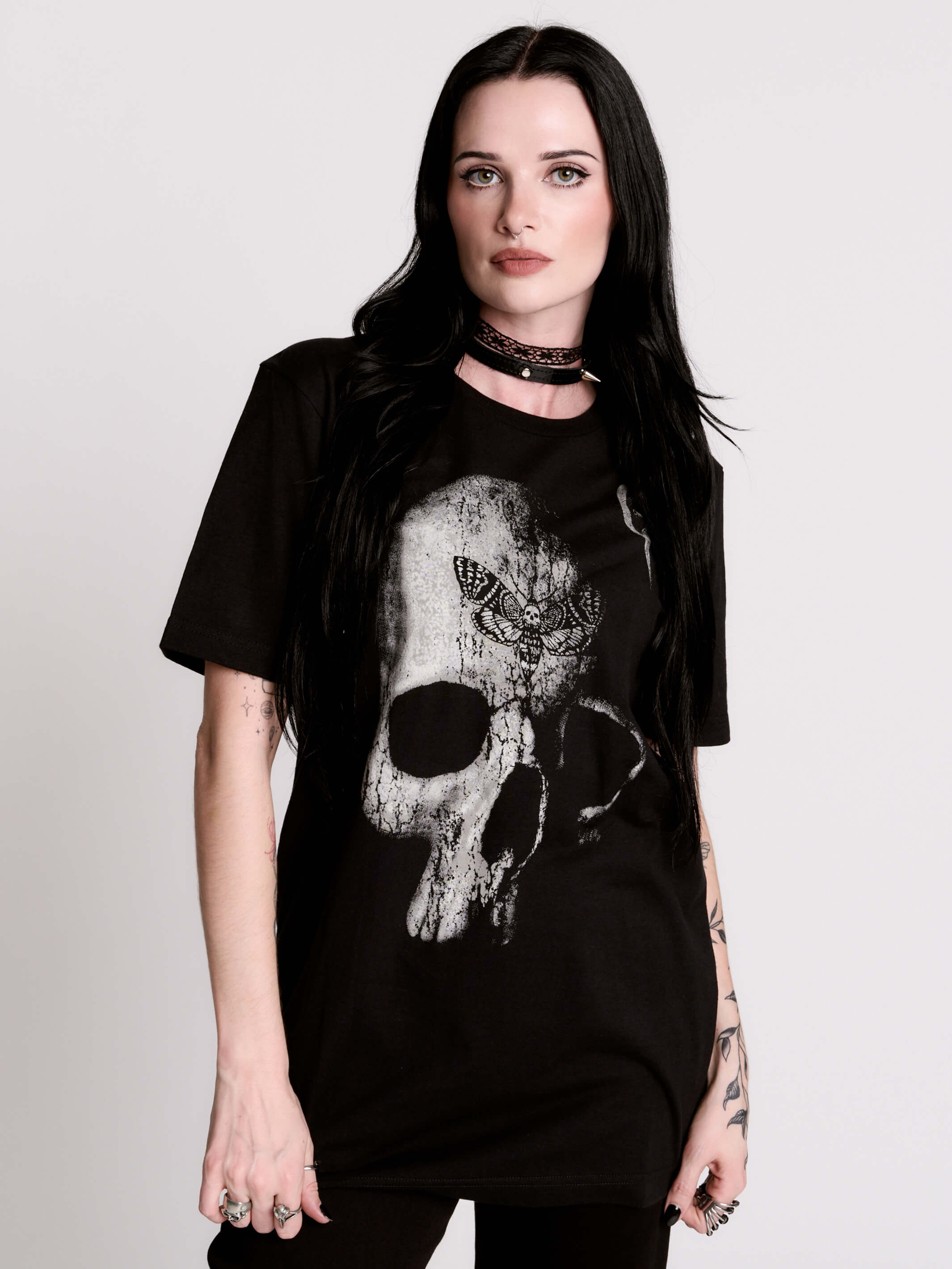 A black t-shirt with a large white skull graphic on the front.