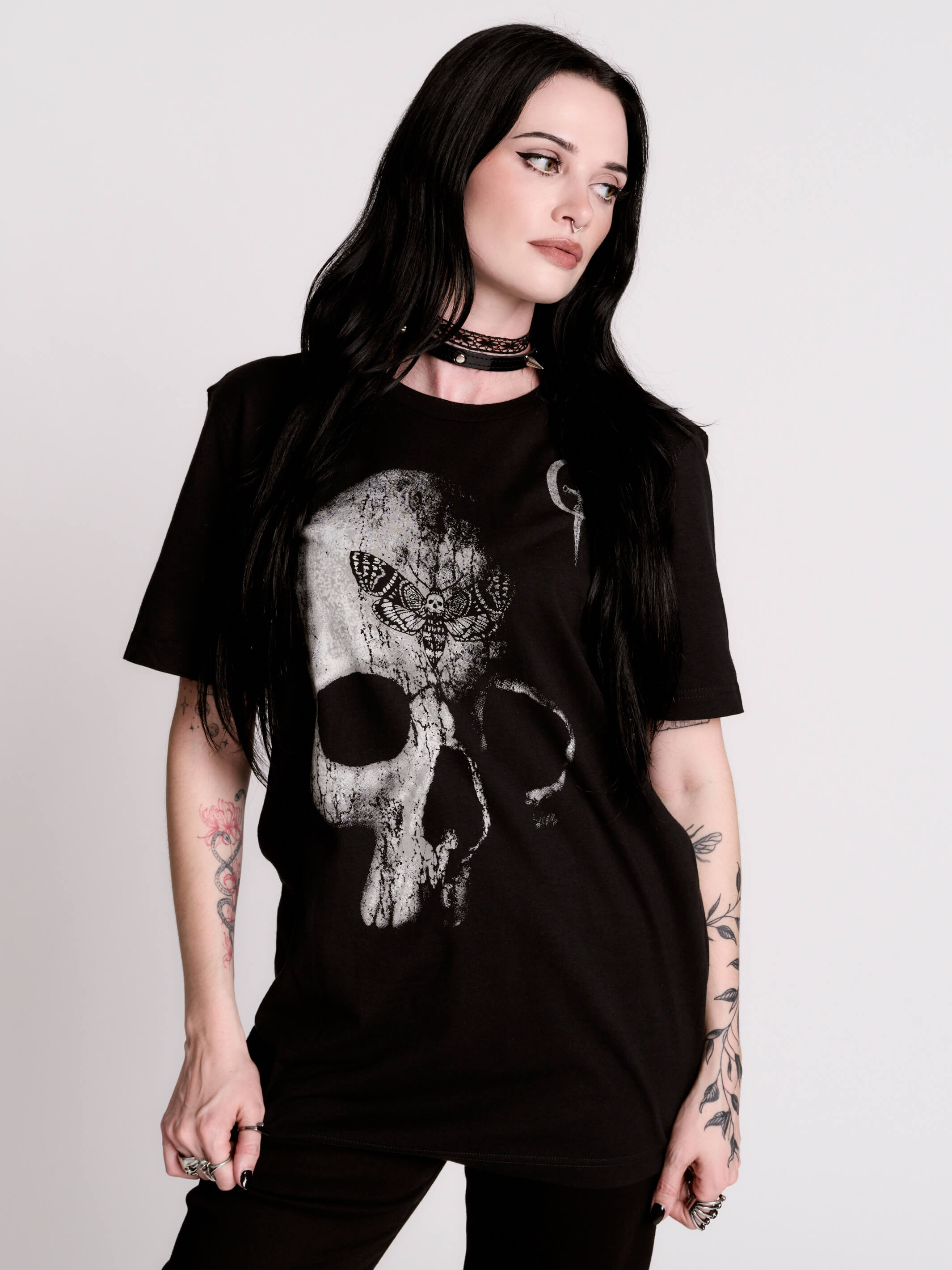A black t-shirt with a large white skull graphic on the front.