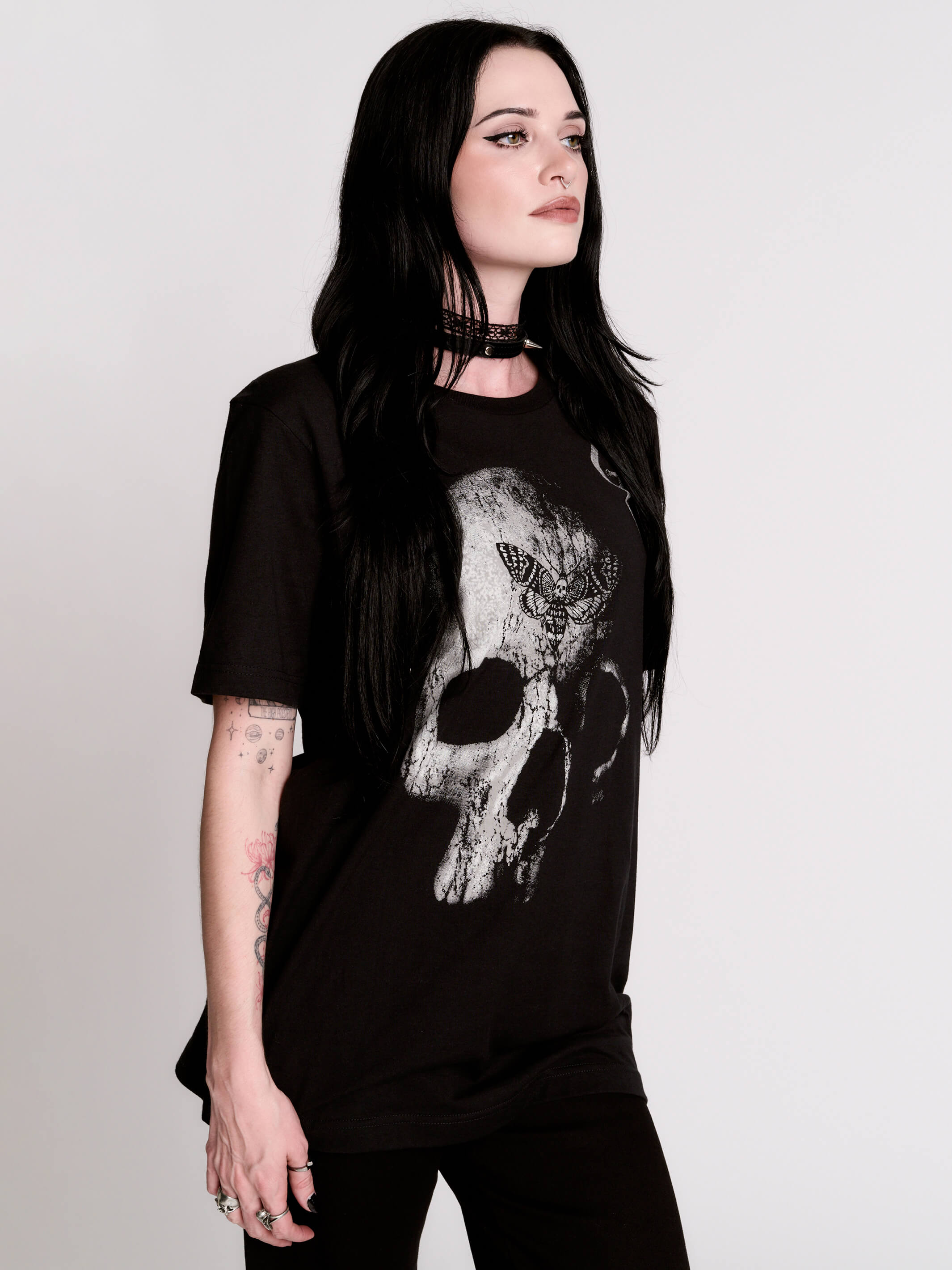 A black t-shirt with a large white skull graphic on the front.