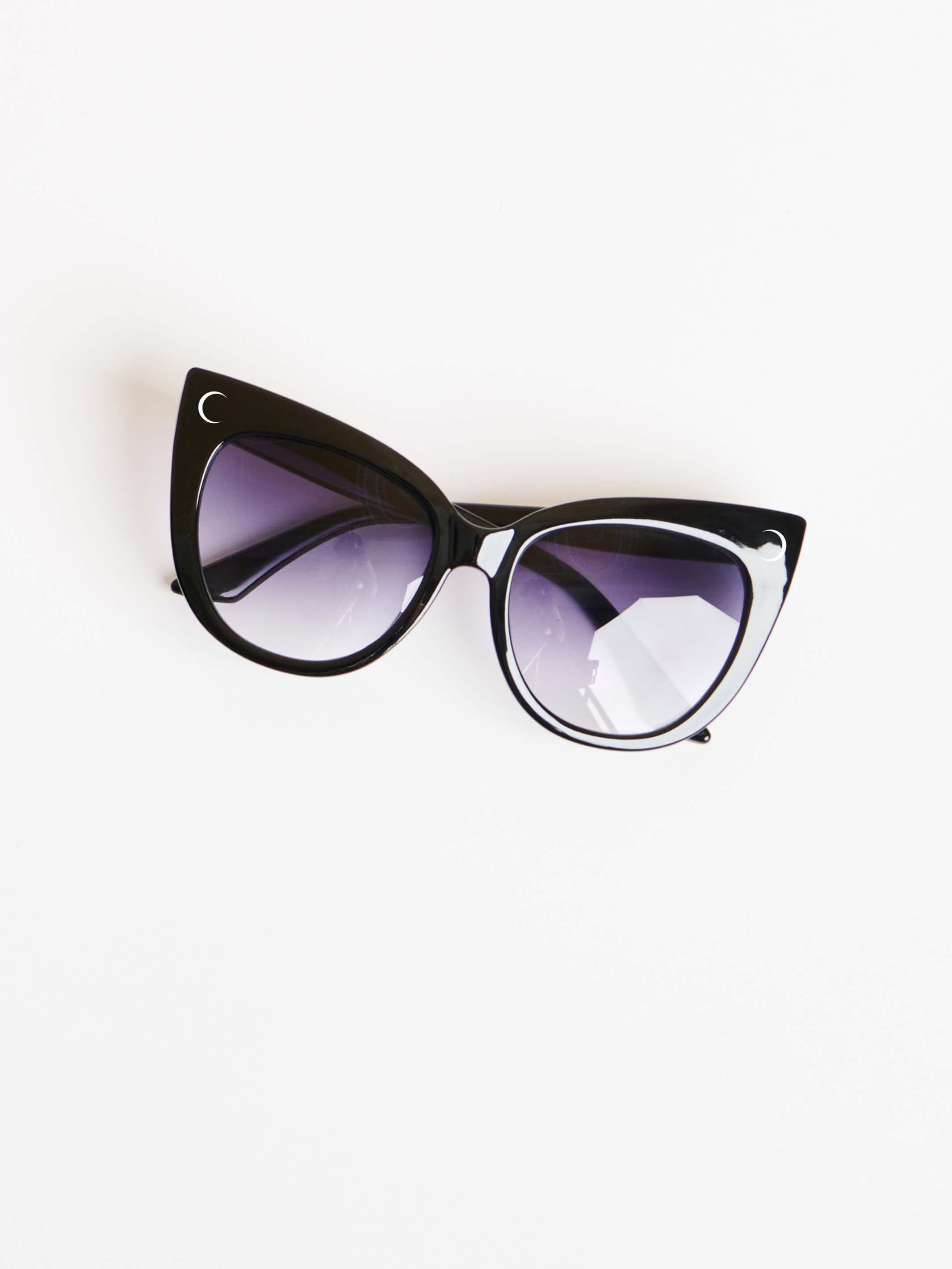 oversized cat eye sunglasses and with clean slick lines, featuring our signature Crescent Moon Logo on front right corner and Midnight Hour logo on the side.