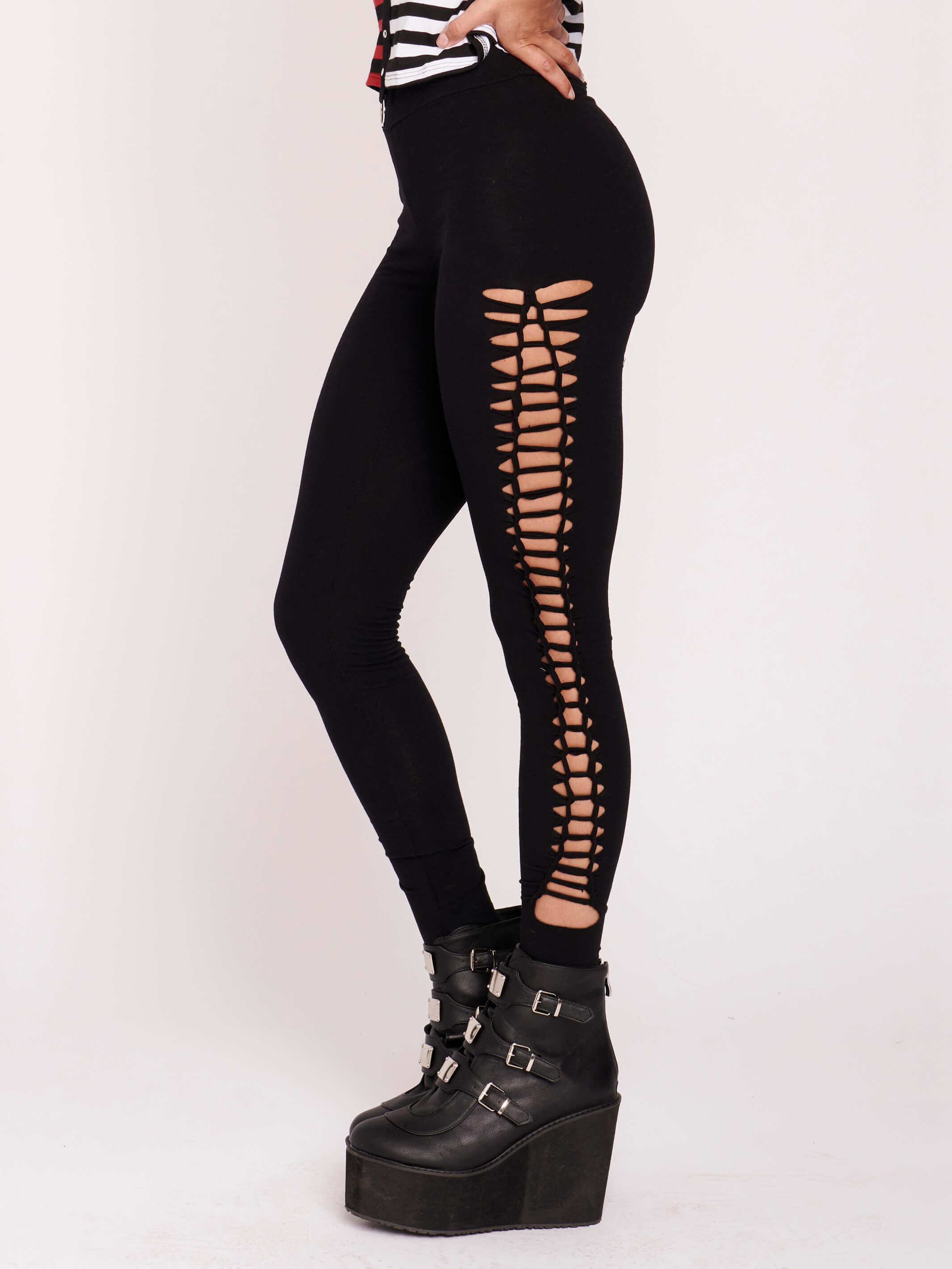 Stretchy cotton spandex leggings with slashed and braided side details.