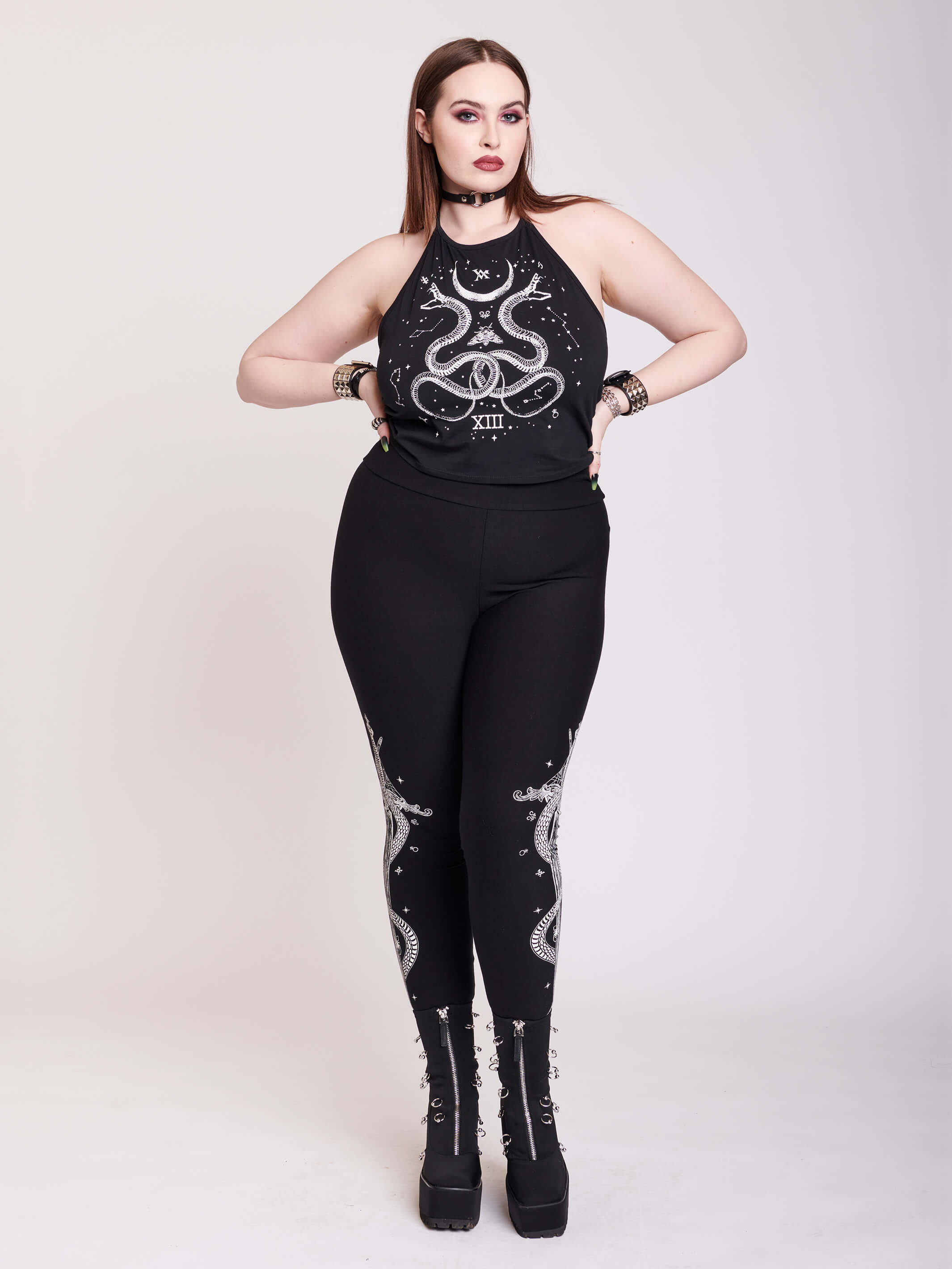 black legging with snake and dagger graphic on side