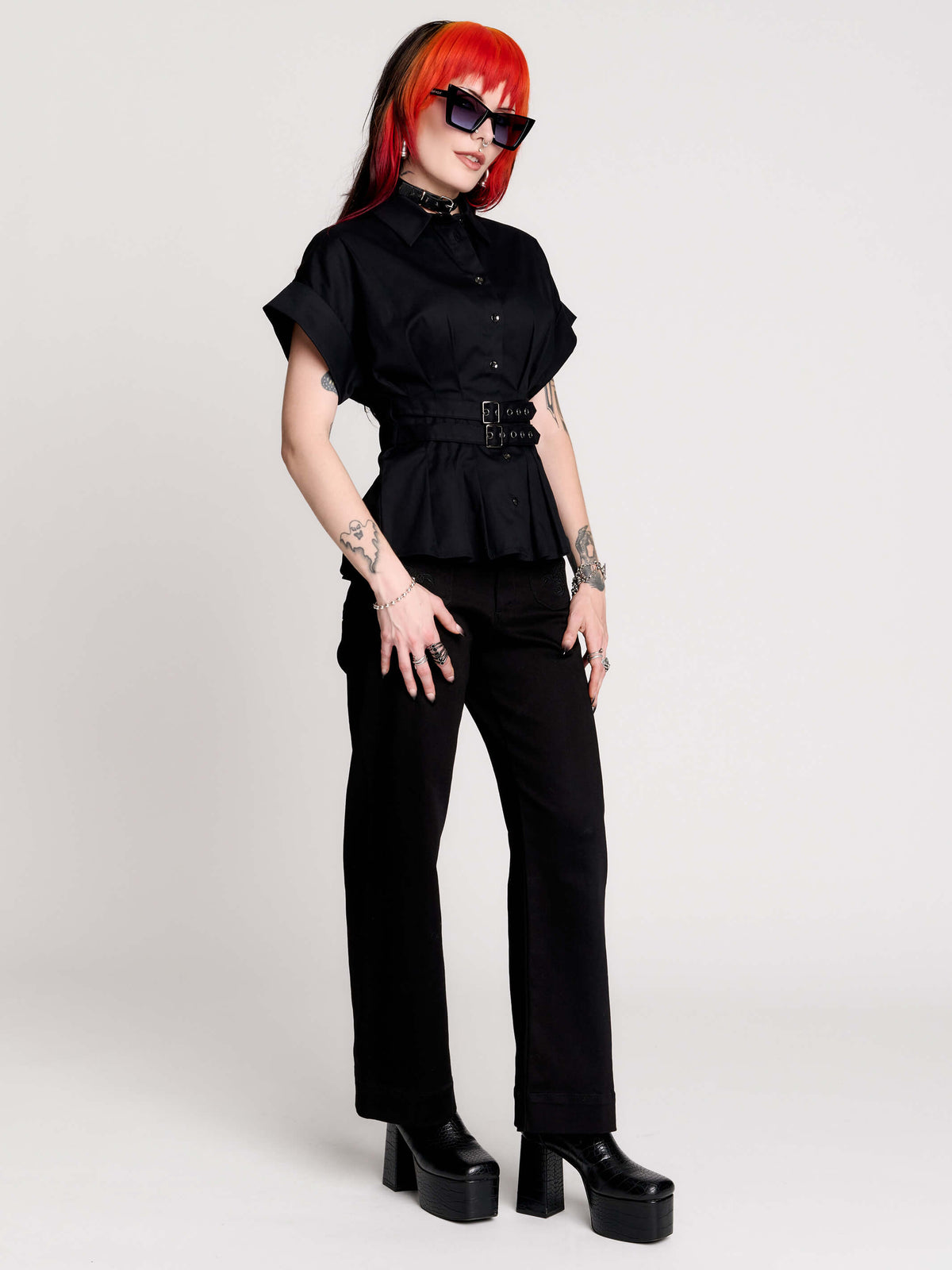 a black short-sleeve button-front shirt dress with a matching double-buckle front waist details.