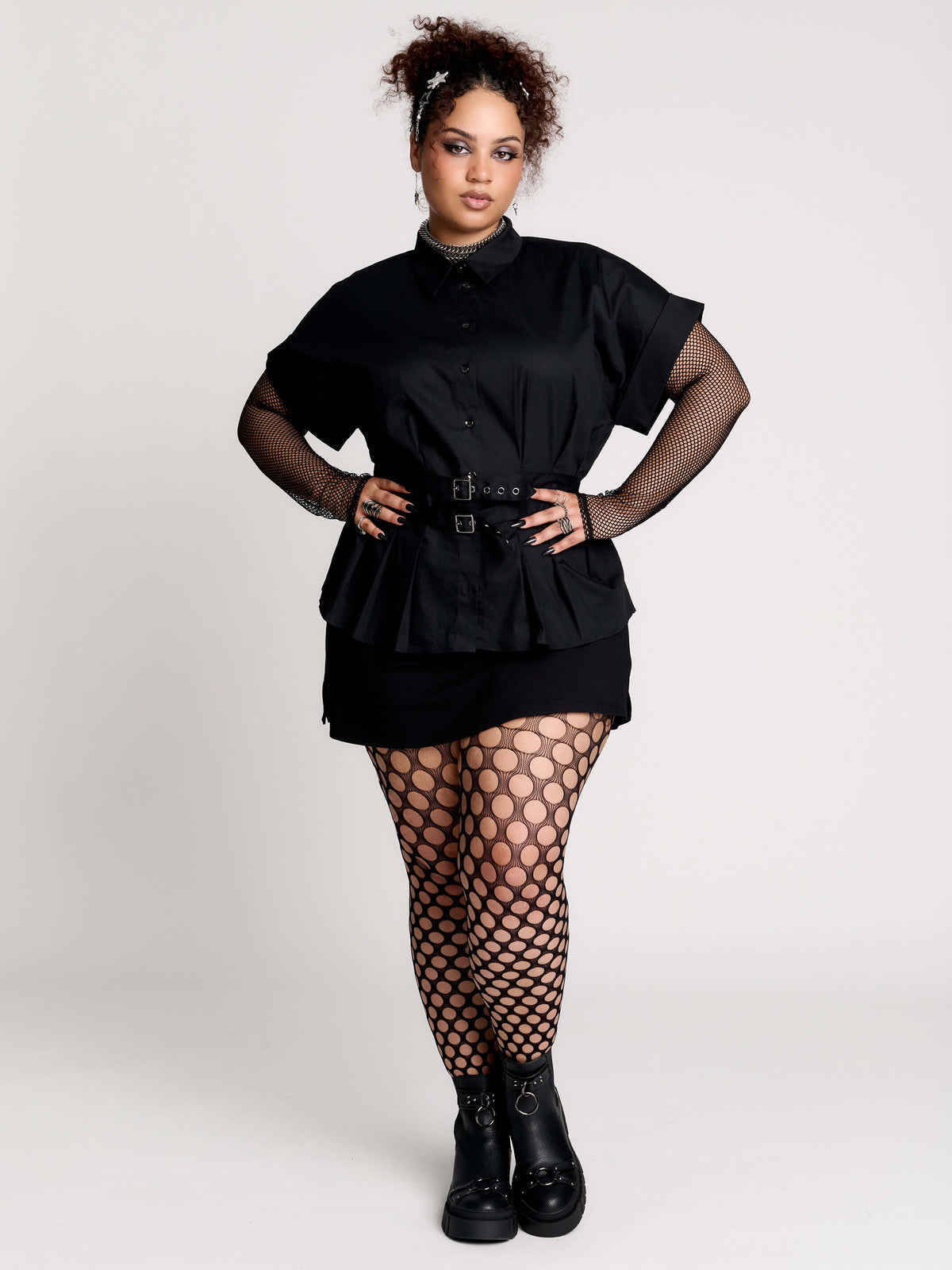 a black short-sleeve button-front shirt dress with a matching double-buckle front waist details.