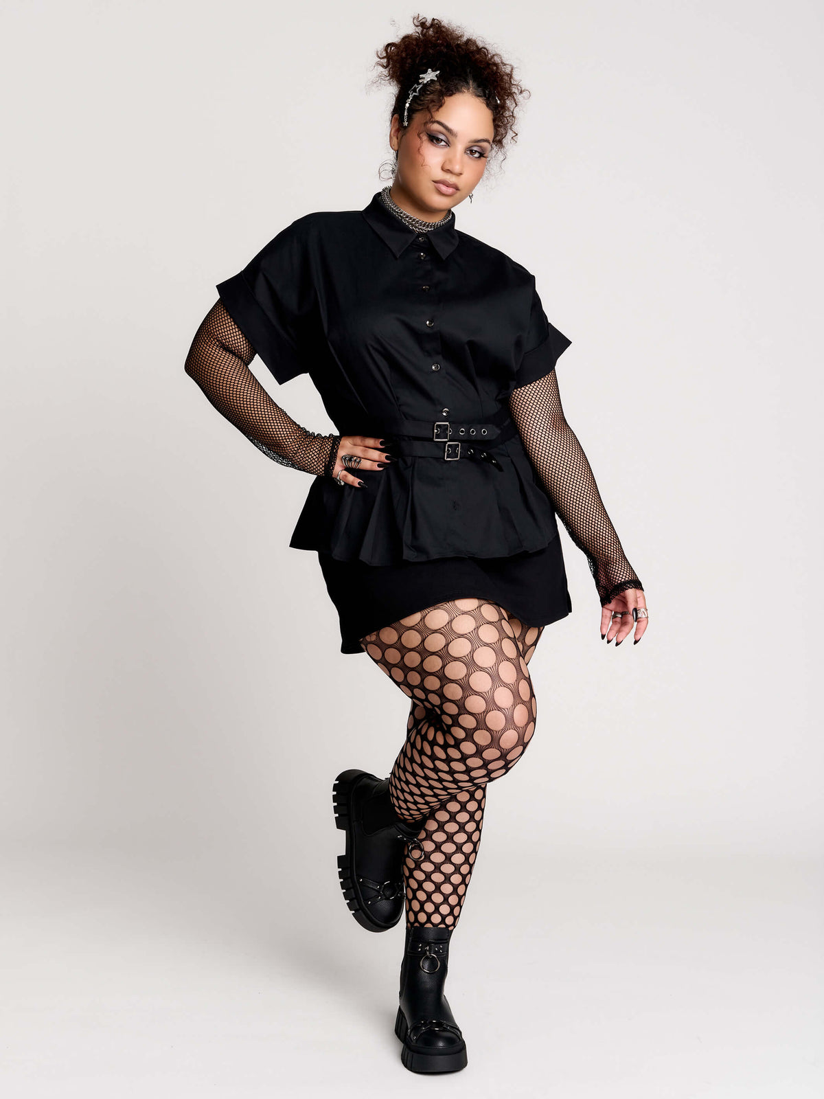 a black short-sleeve button-front shirt dress with a matching double-buckle front waist details.