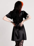 black satin short-sleeve dress with lace trim