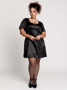 black satin short-sleeve dress with lace trim
