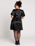 black satin short-sleeve dress with lace trim