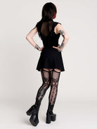 a black sheer mock-neck top with a black graphic on the chest