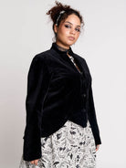black velvet jacket with a black-and-white patterned lining