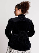 black velvet jacket with a black-and-white patterned lining and back lace up detail