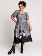 short-sleeved gray and black gothic-style midi dress with a printed illustration of a woman and winged figure at the hem
