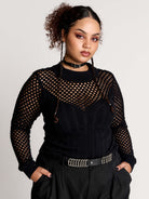 Fishnet Sweetheart Rib Sweater, a black long-sleeve top with a fitted rib-knit body and fishnet across the upper chest, shoulders, upper back and sleeves, giving a  “sweetheart” illusion while keeping the sleek silhouette sleek.