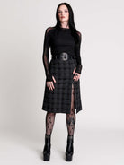  a black and gray plaid midi skirt with a front slit, 