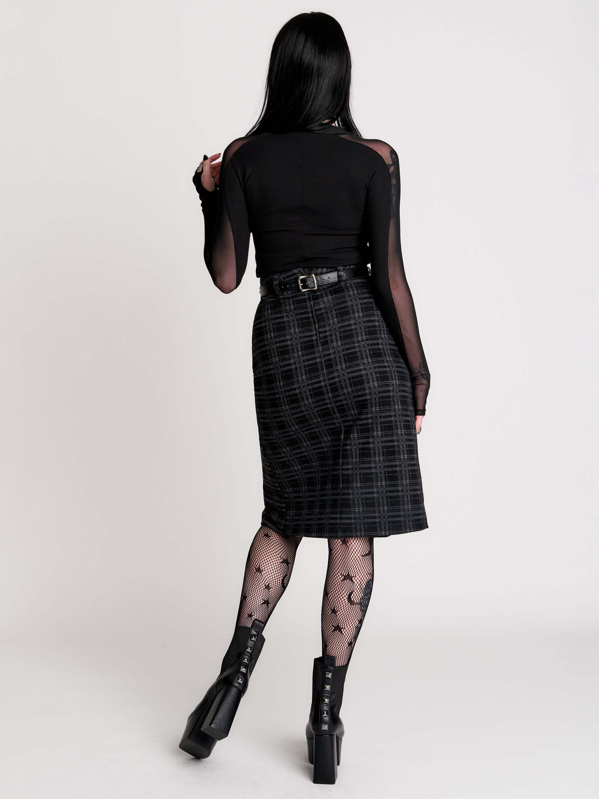  a black and gray plaid midi skirt with a front slit, 