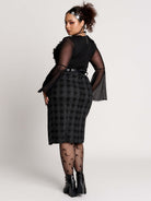  a black and gray plaid midi skirt with a front slit, 