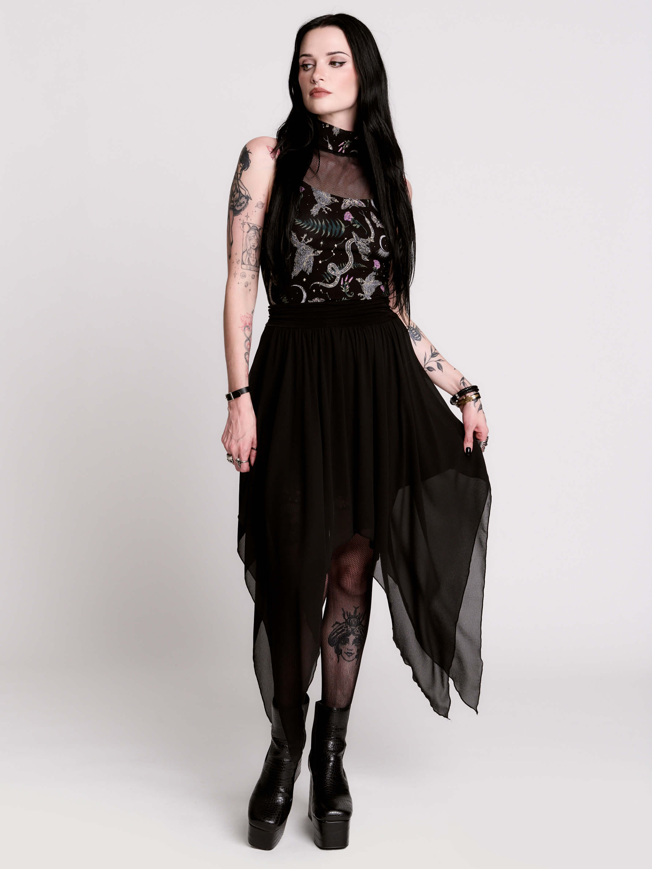 A black sleeveless top with a high mesh neck and an allover gothic-style print featuring silver snakes, moths, ravens and small pink floral accents.