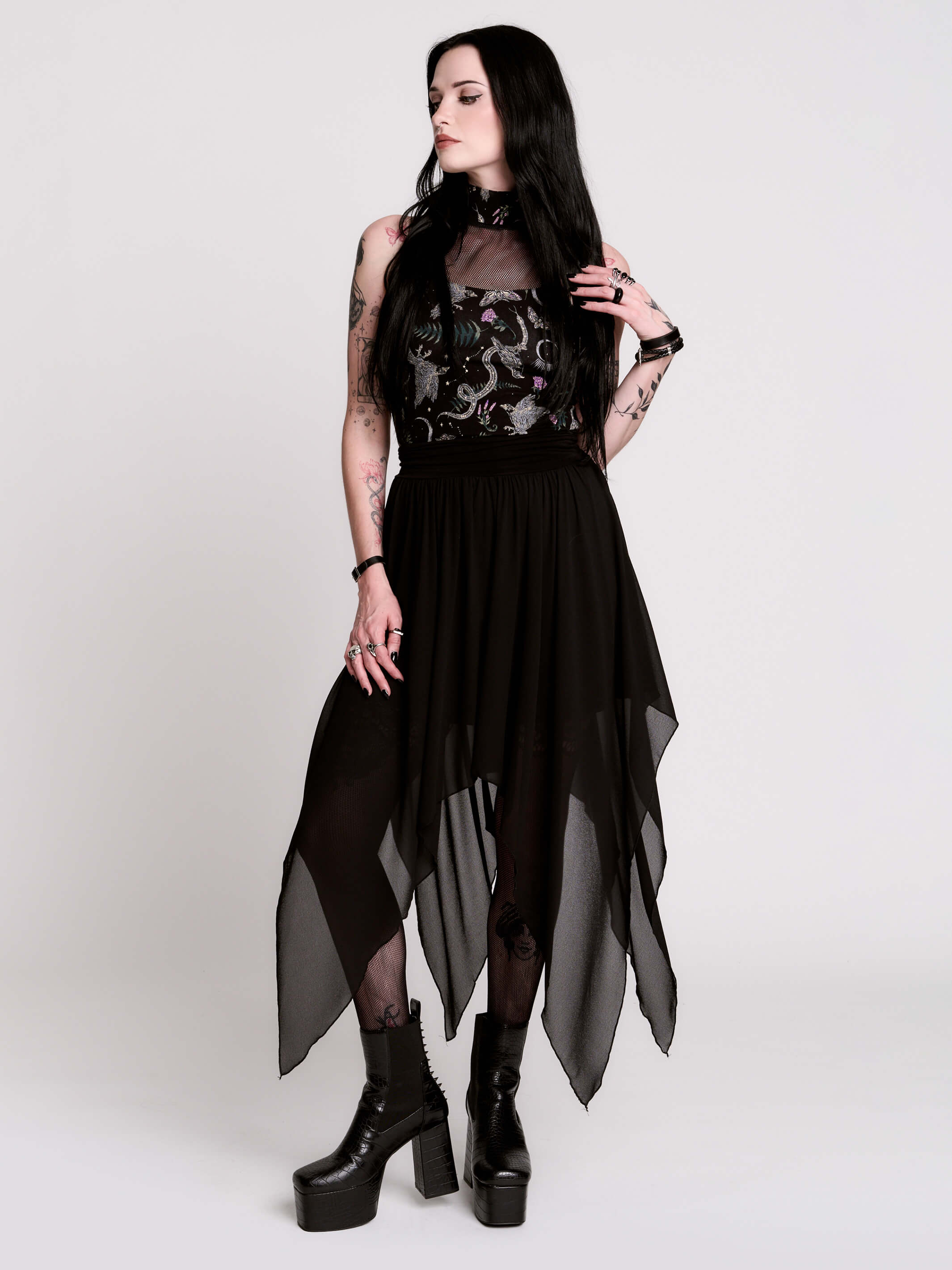 A black sleeveless top with a high mesh neck and an allover gothic-style print featuring silver snakes, moths, ravens and small pink floral accents.
