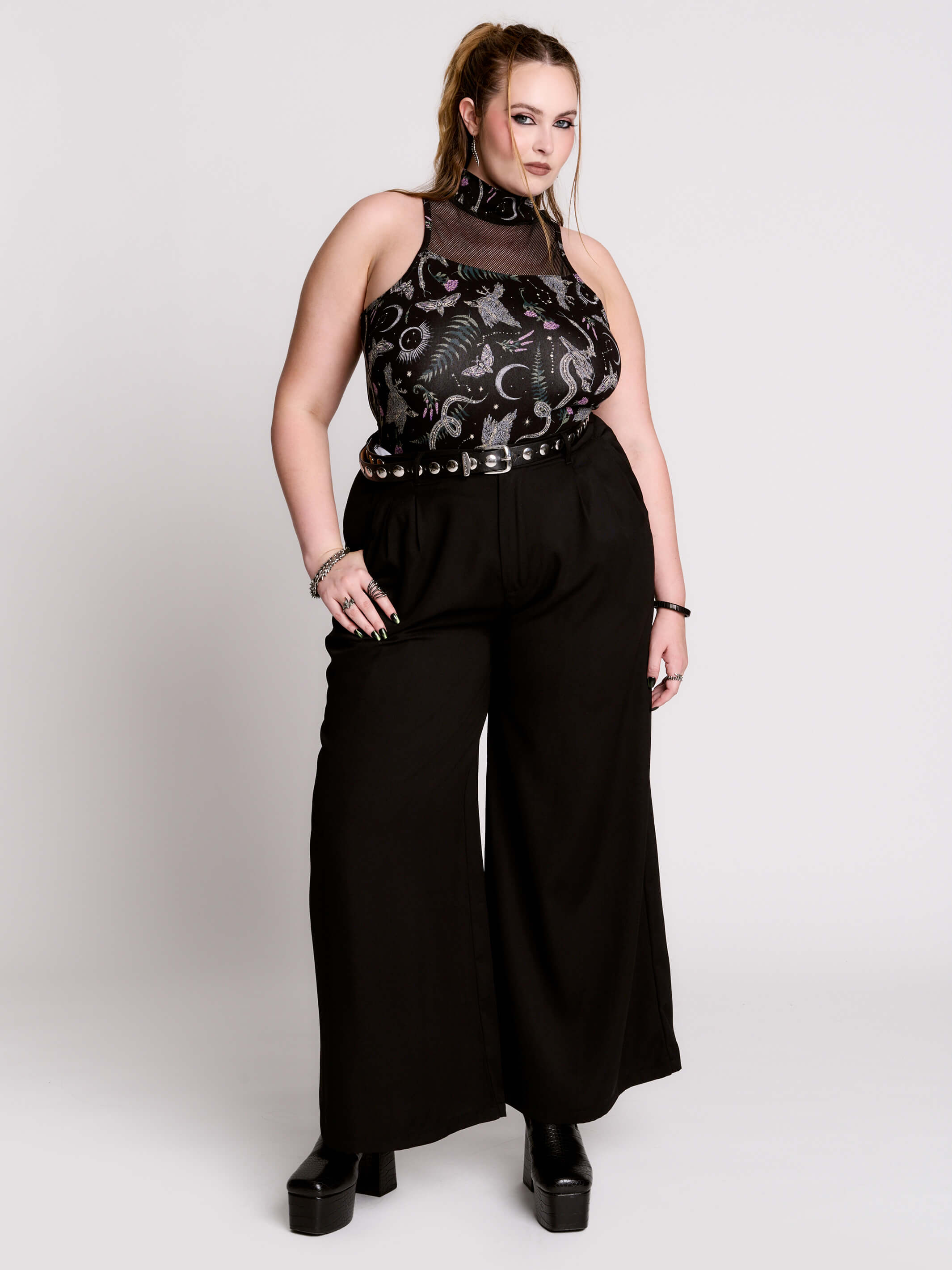 A black sleeveless top with a high mesh neck and an allover gothic-style print featuring silver snakes, moths, ravens and small pink floral accents.