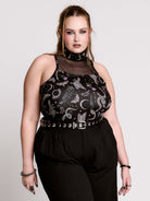 A black sleeveless top with a high mesh neck and an allover gothic-style print featuring silver snakes, moths, ravens and small pink floral accents.