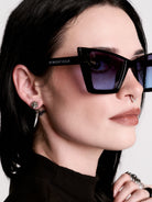 Skull horn earring
