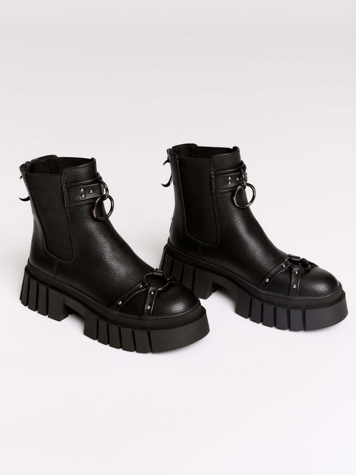 Black chunky platform ankle boots with buckle straps.