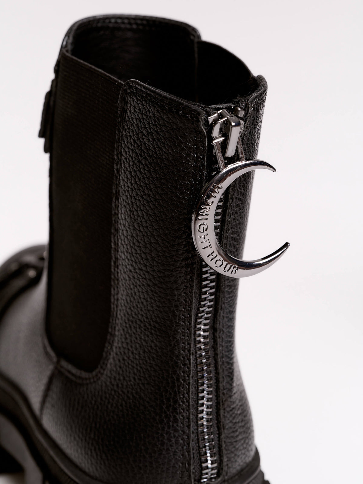 Black chunky platform ankle boots with buckle straps.